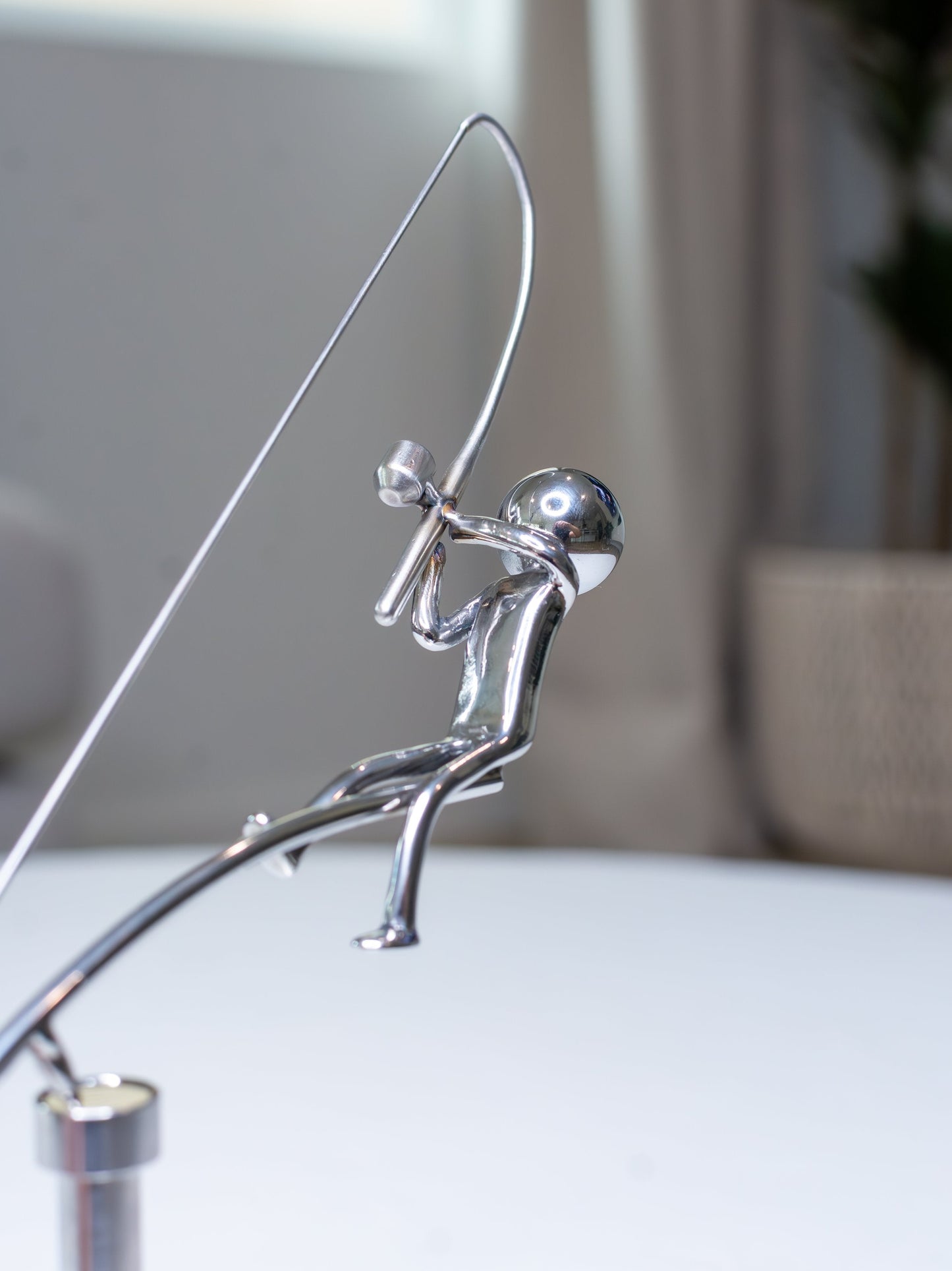 đŁFiskaren balanserar skulptur
